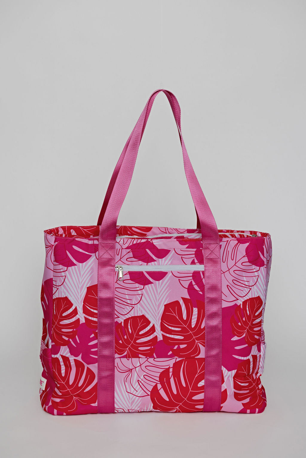 Pink tote bag with trolley sleeve for easy carry on