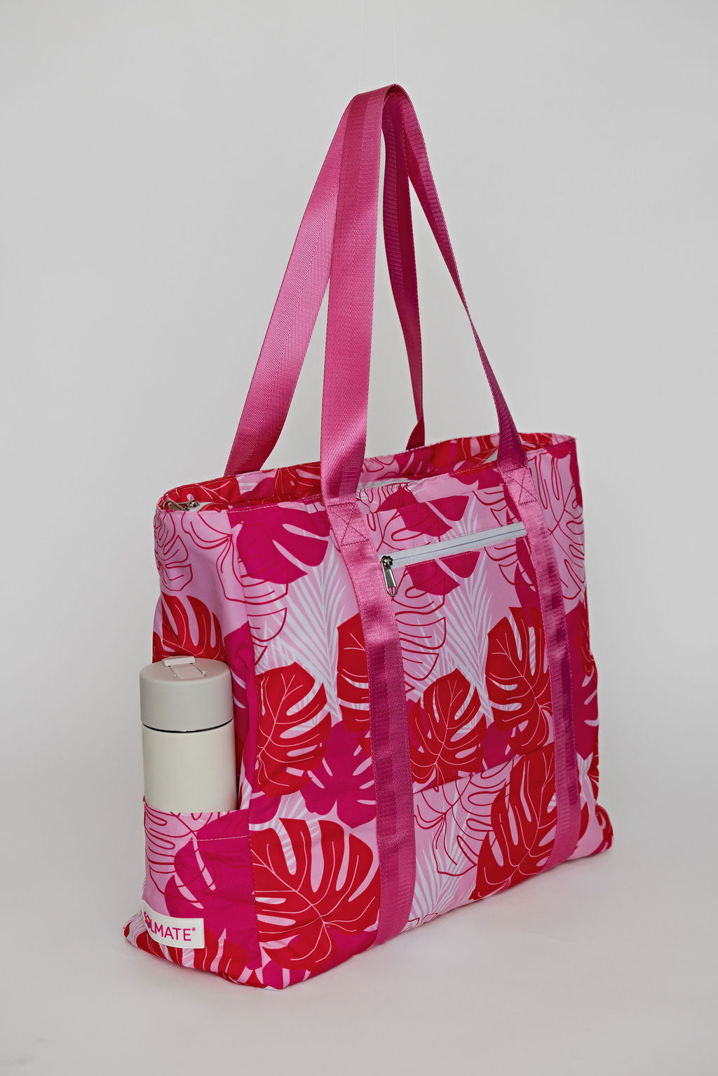 Pink Solmate tote with exterior pockets for carry on