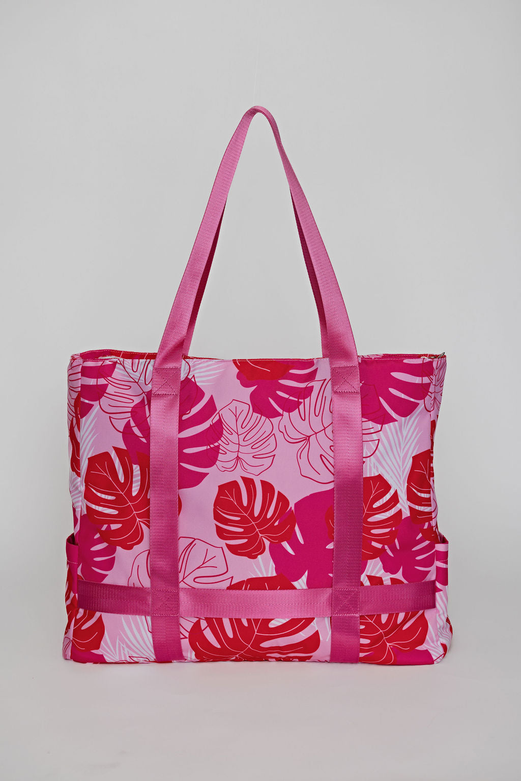 Pink solmate tote bag with straps to carry sunhat when traveling