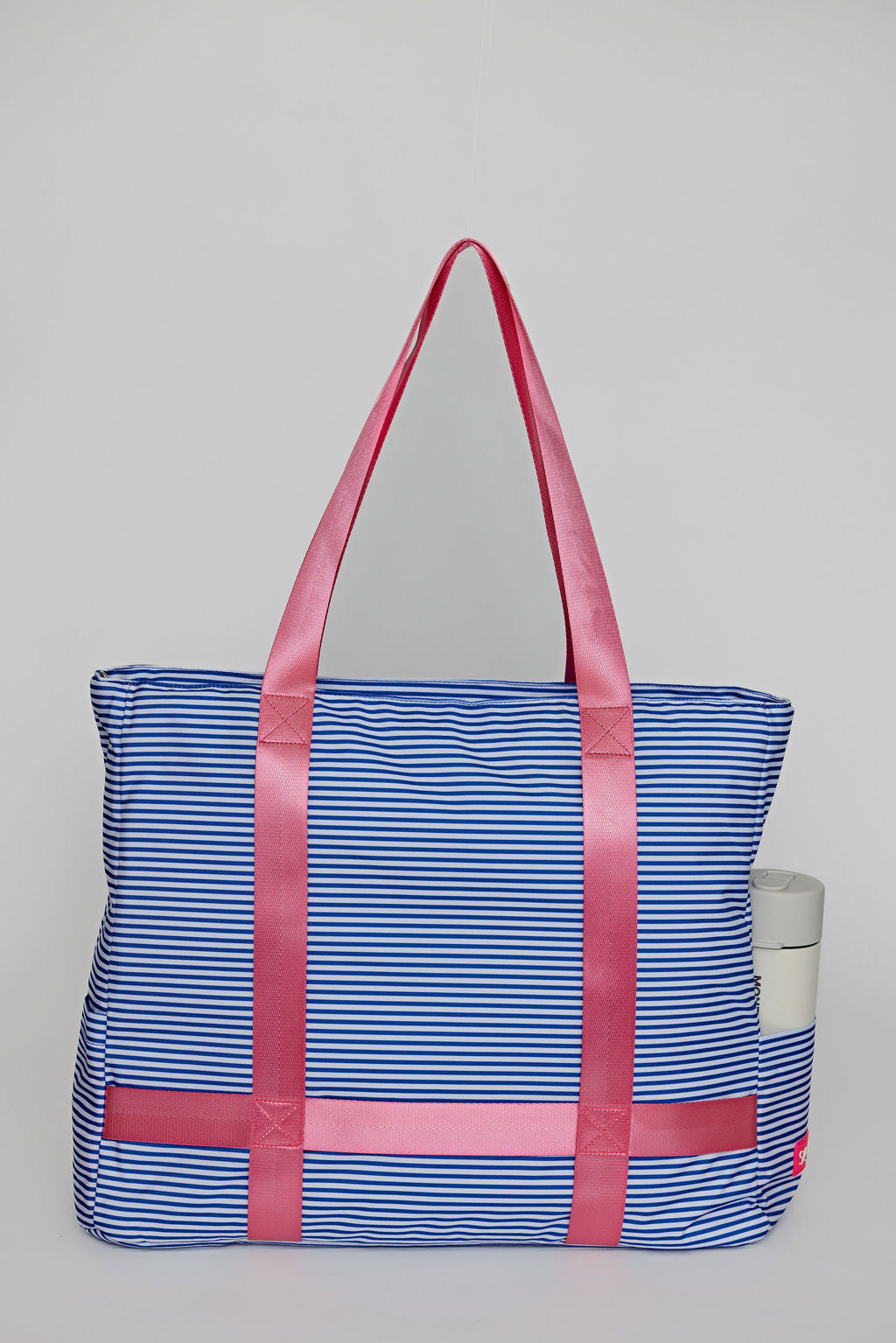 Blue striped tote bag with straps to carry your sunhat