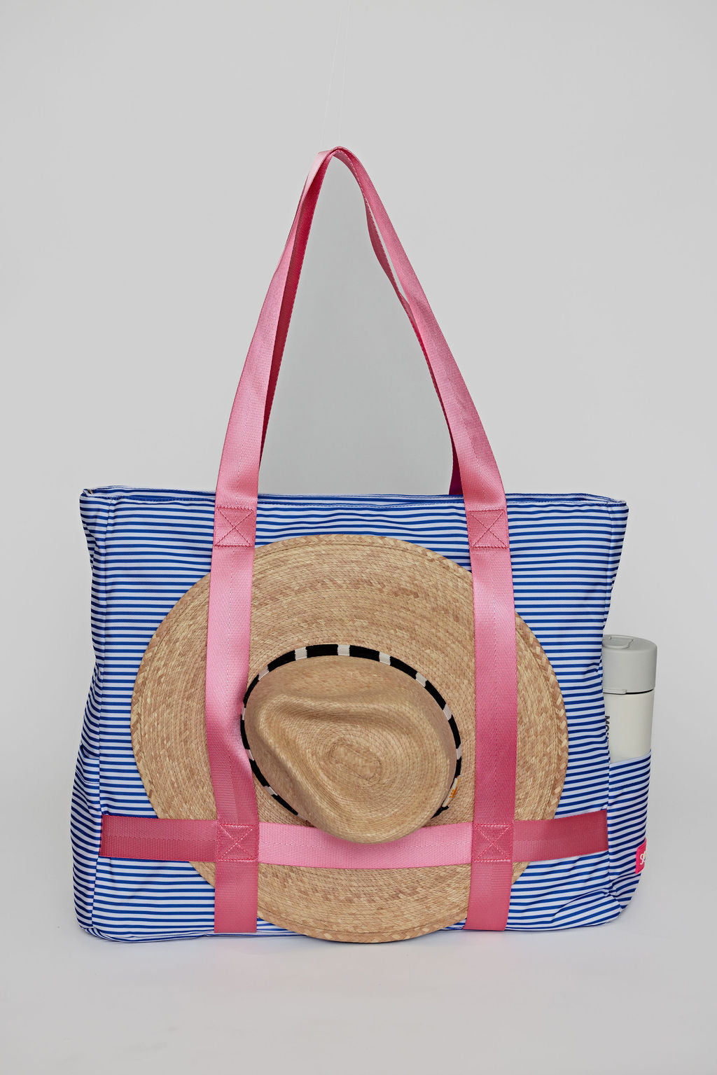 blue striped solmate tote carrying sunhat for easy travel