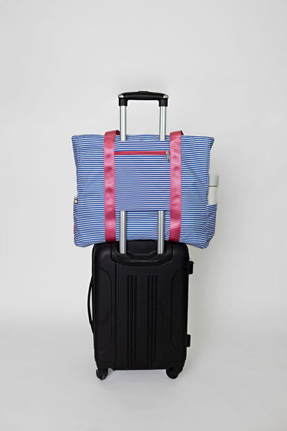 blue striped solmate tote with trolley sleeve on carry on suitcase