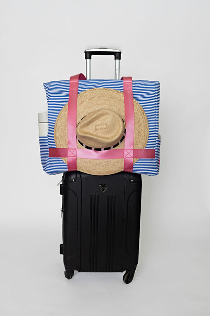 blue striped solmate tote with straps to carry wide brim hat on carry on suitcase